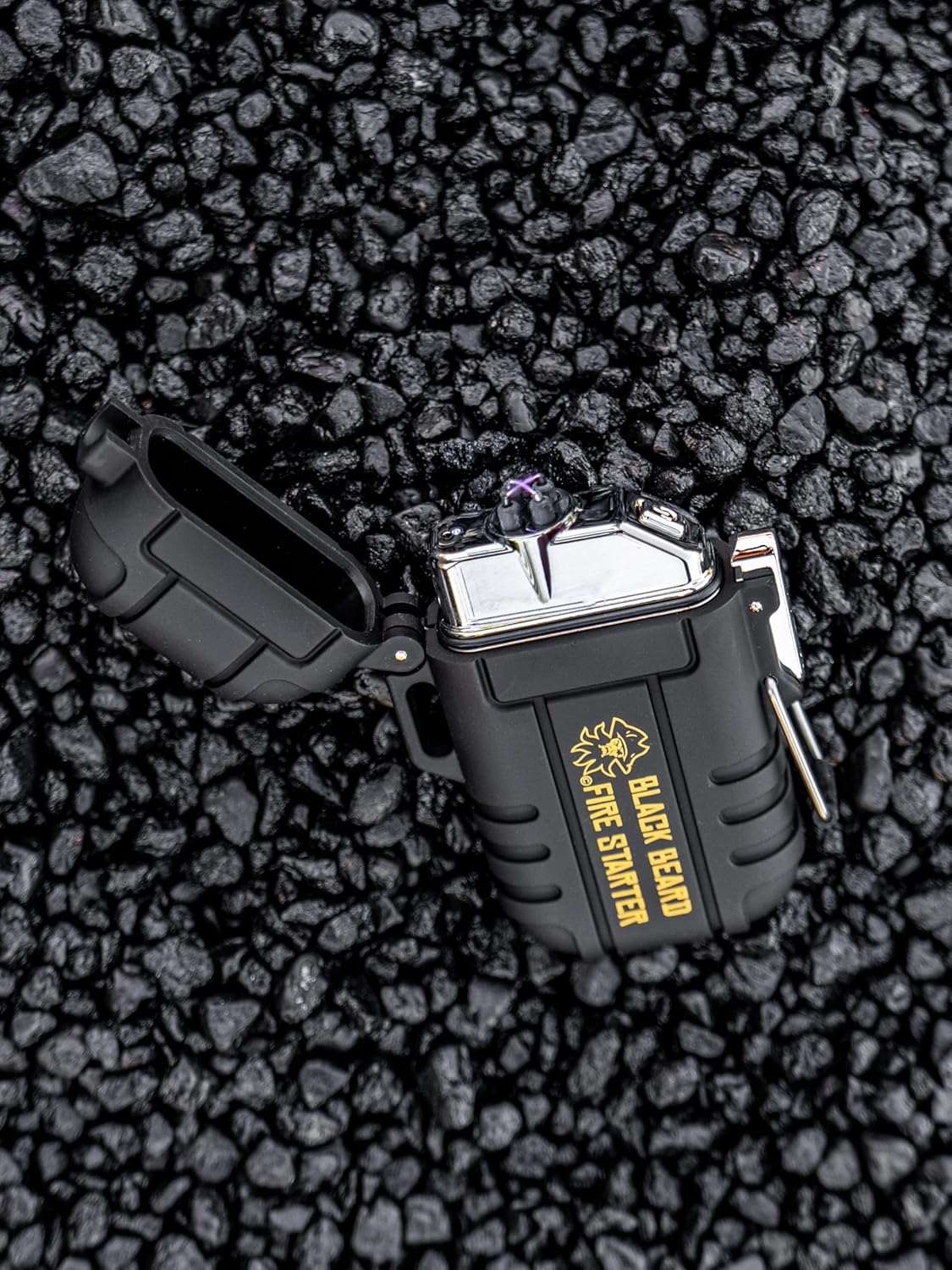 Black Beard Arc Lighter with a black rugged case, open hinged lid, silver top and yellow fire-starting emblem